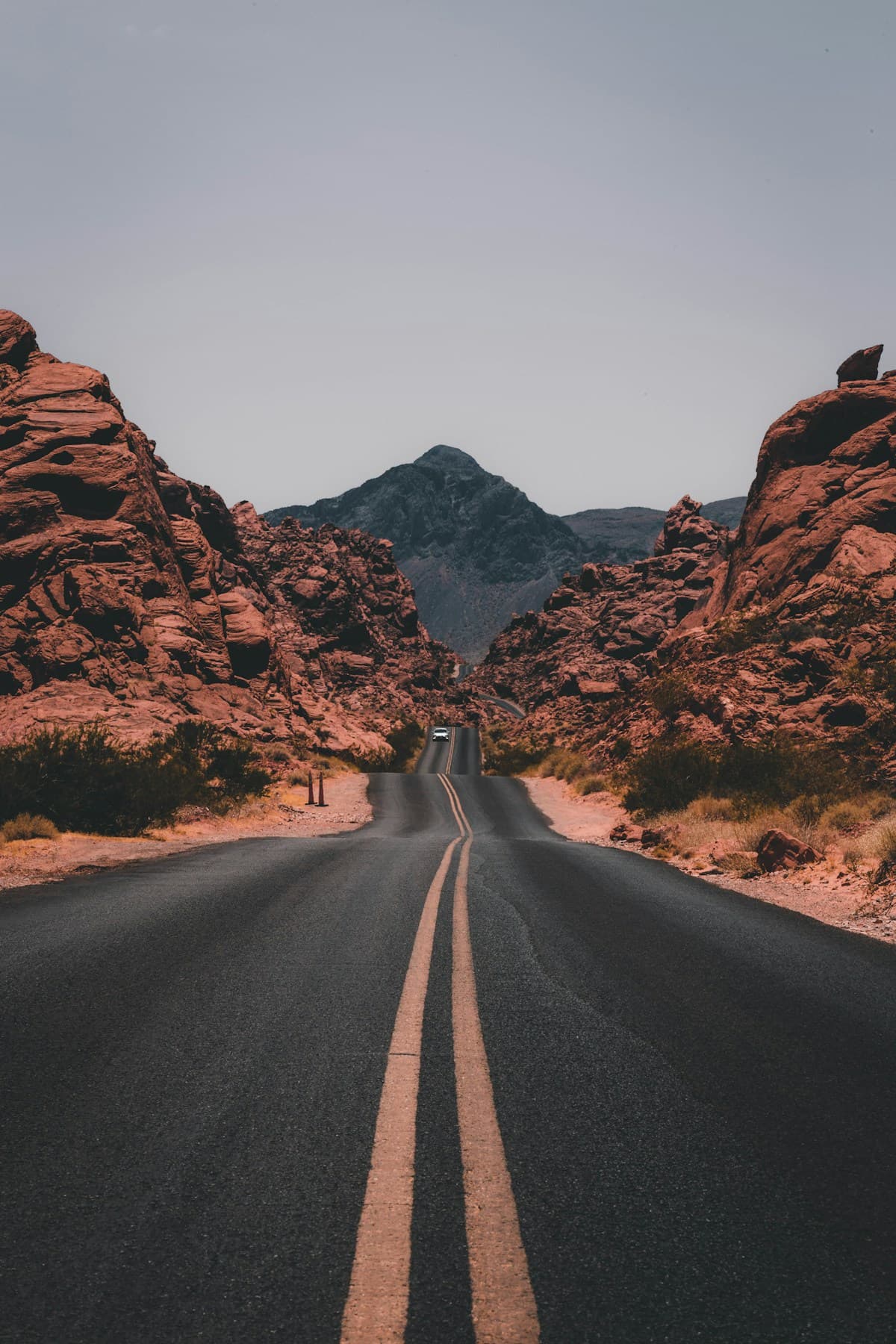 Sunlit desert cliffs and a winding trail